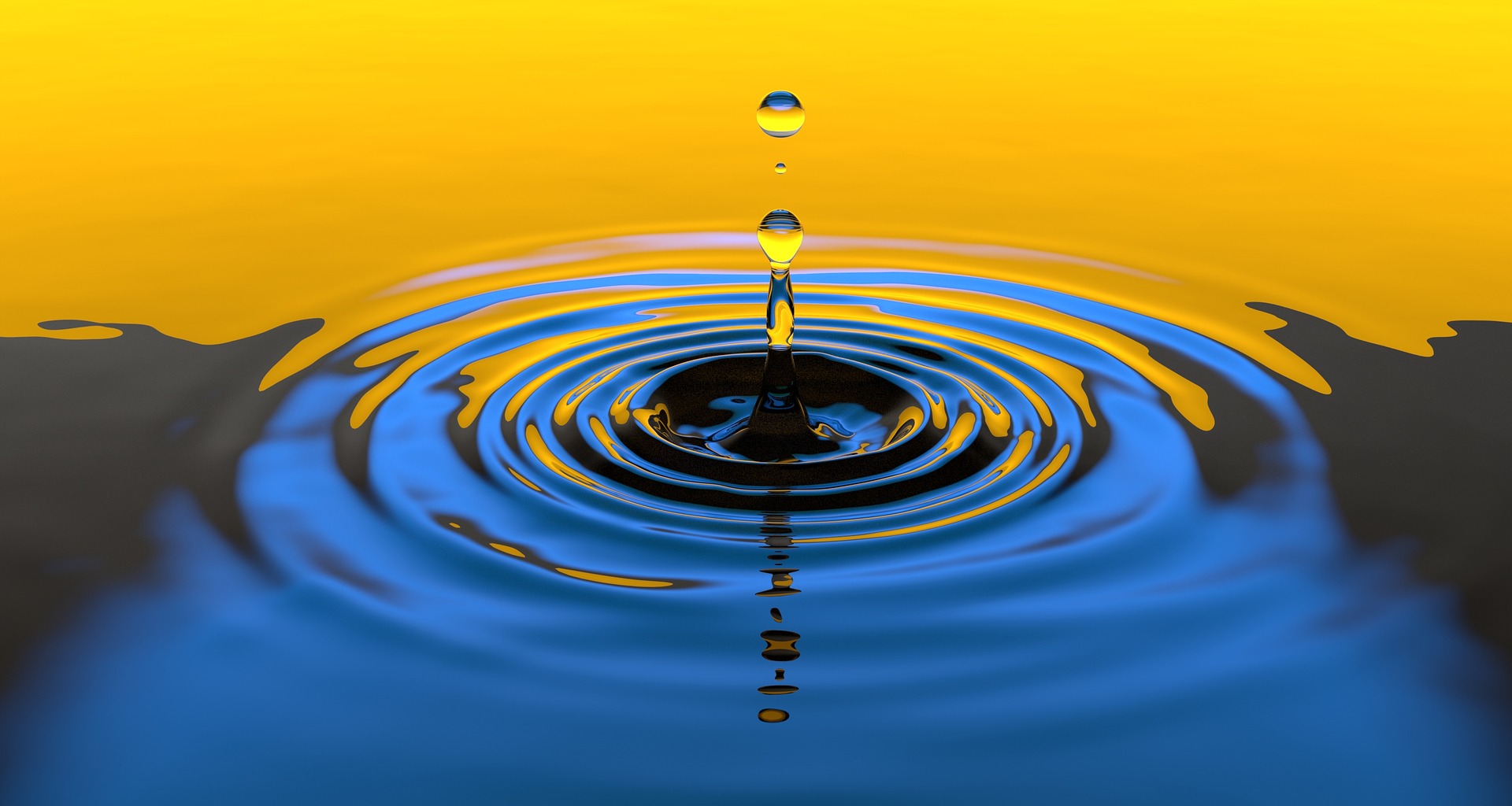 A water drop hitting the surface creating expanding ripples—showing how one small action creates waves of change